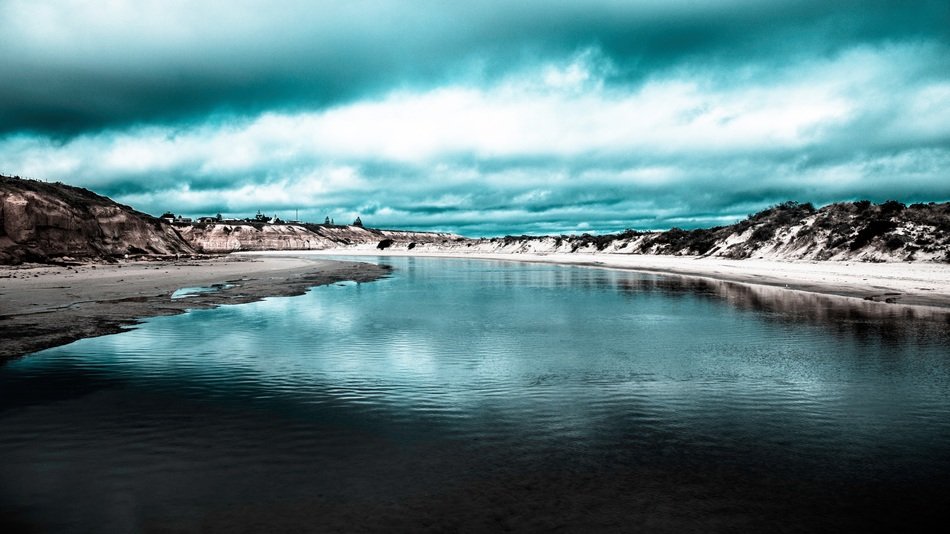 grey blue sky and river