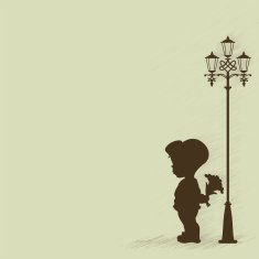 Boy with bouquet standing under a street lamp
