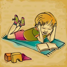 young boy reading on a carpet