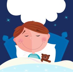 Small boy with his teddy bear sleeping in bed