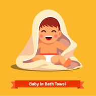 Happy baby boy toddler wrapped in bath towel
