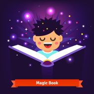 Boy kid reading magic spell book as it glows