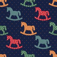 Seamless pattern with rocking horses on dark blue background