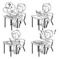 Cute schoolboy behind a school desk