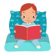 boy reading book on bed