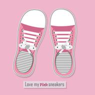 Pair of pink sneakers on background