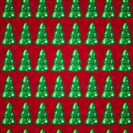 Seamless pattern with Christmas trees on red background