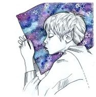 Peaceful boy sleeping with night sky pillow