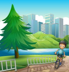 boy biking across the tall buildings near river
