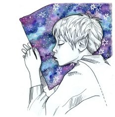 Peaceful boy sleeping with night sky pillow