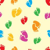Colorful footprints on beige background