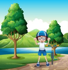 Young boy and his toy bike standing near trees