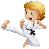 Cute little boy doing karate