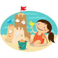 Cute girl making a sand castle on the sea beach