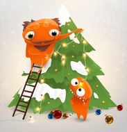 Cute monsters decorating a Christmas tree