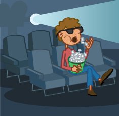 Boy eating popcorn watching movie in cinema