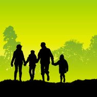Family walk by woods in the green countryside