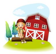 girl sitting in front of a red barnhouse