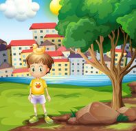 boy with rubber duck above his head standing near tree