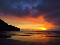 evening sky over the beach in the orange twilight