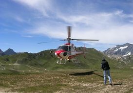 Picture of the helicopter in a valley in the alps