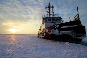 Ship in the snow at lake Erie at colorful and beautiful dusk background