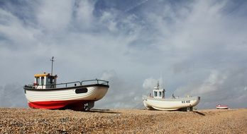 fishing boats in the sand