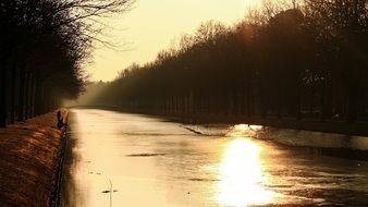 sun trail at sunset on the river