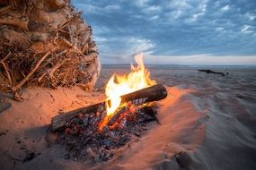 cozy bonfire on the beach in the evening