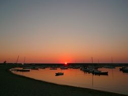 port on a ocean bank at the sunset