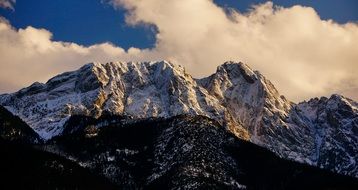 giewont Mountains on a background of white clouds in winter, poland