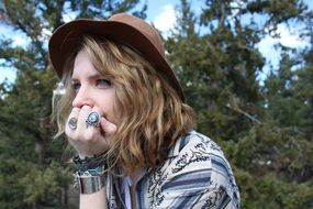 Girl is thinking near the trees