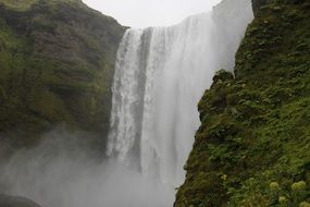 strong waterfall in iceland