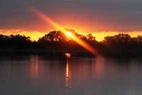 orange twilight reflected in the lake