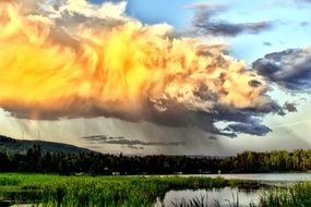 amazing clouds over the lake in the forest