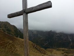 cross against rainy sky