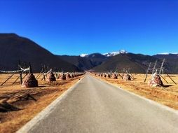 road with a scenic Tibetan landscape