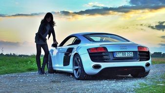 audi r8 and young woman