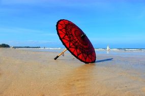 Red umbrella on the beach