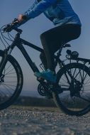Woman on mountain bike evening scene