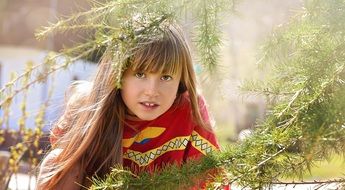 girl with long hair on the background of nature
