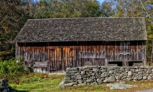 scenic weathered barn behind wildstone wall, usa, connecticut