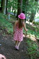 Girl is walking in the forest