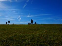 wanderers on top of a mountain in Switzerland