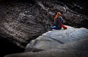 lonely girl sitting on the edge