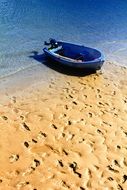 Boat on the sand on a sunny day