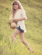 picture of girl with straw hat in a field