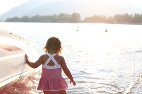 girl in swimsuit on a lake