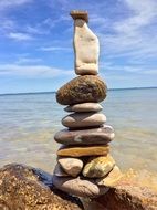 stones piled on top of each other in the sand