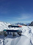 Two colorful snowboards on the white snow in beautiful New Zealand